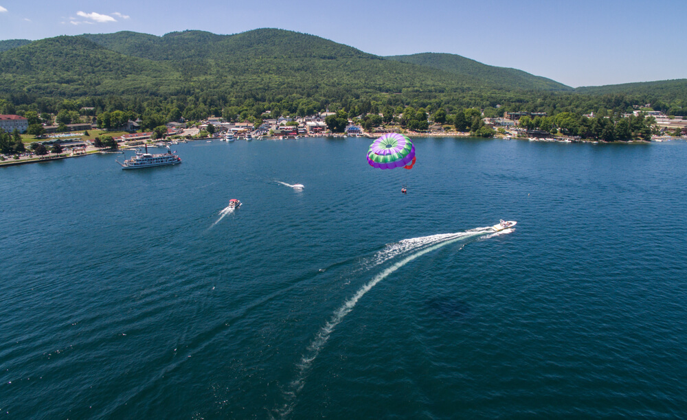 Photo of person parasailing during an outdoor adventures in lake george