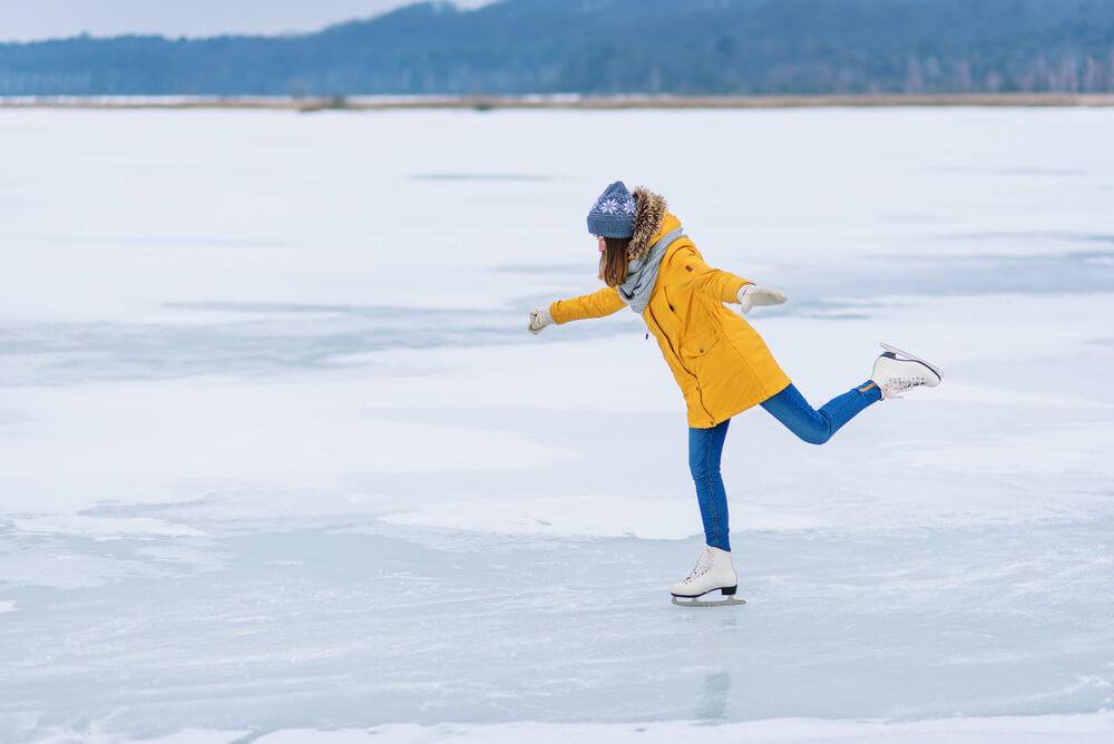 Photo of a person ice skating during Lake George winter