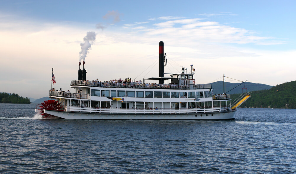 Photo of Lake George boat cruises on a steamship with mountain background