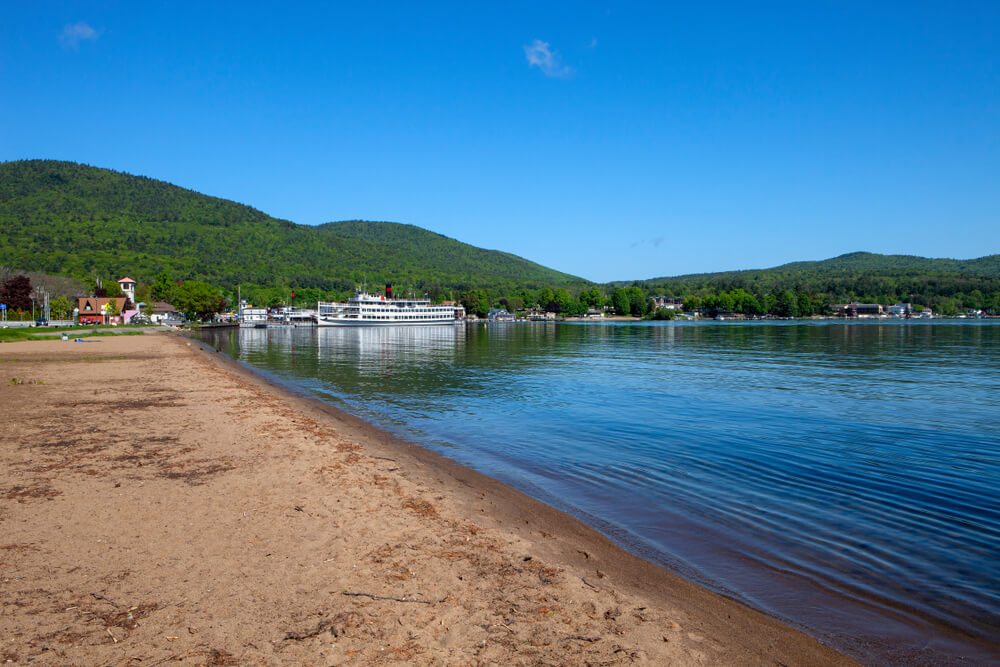 View of Lake George park and beach during summer