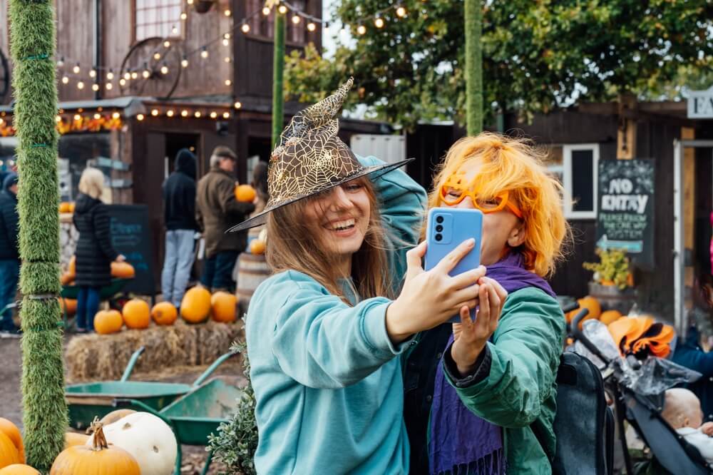 People taking a picture in their fall outfits at a Lake George festival