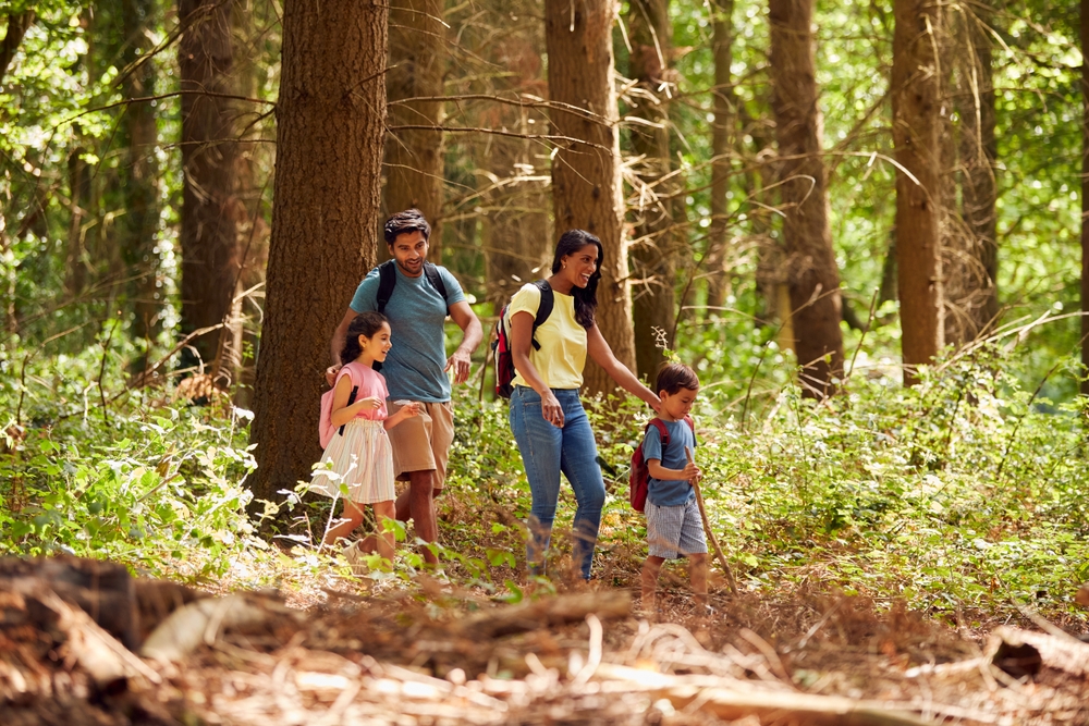 Family on a hike during a New York family vacation in Lake George